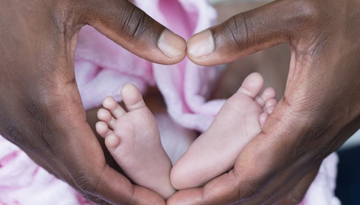 Hands with baby feet